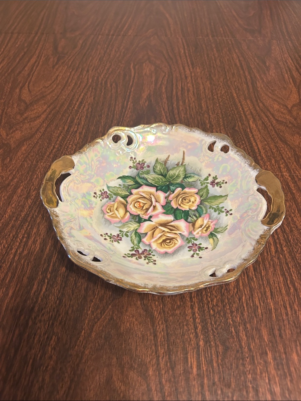 Iridescent pre-war Japanese trimont ware dish with pink and yellow flowers.